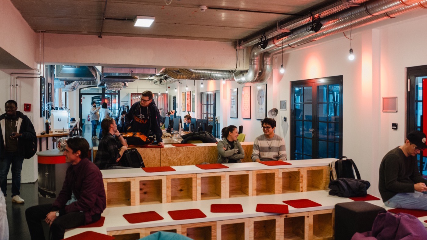Community event at the incubator with red tiered seating